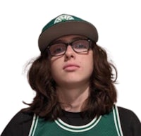a young man wearing glasses and a green basketball jersey