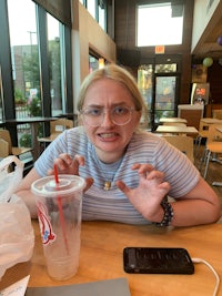 a girl sitting at a table