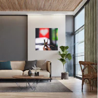 a living room with a couch and a picture on the wall