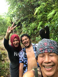 a group of people taking a selfie in the jungle