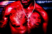 a man with tattoos on his chest