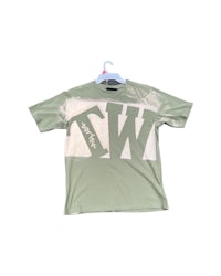 a green t - shirt with the word w on it