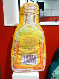 a bottle with a label on it sitting on a table