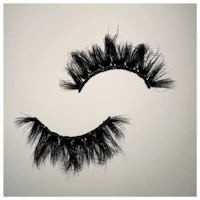 a pair of black mink lashes on a white background