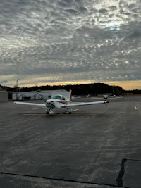 a small airplane parked on the tarmac