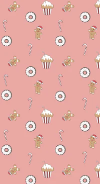 gingerbread cookies and candies on a pink background