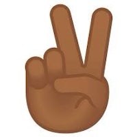 a brown hand making a peace sign on a white background