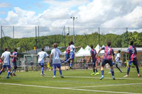 a group of people playing soccer on a field