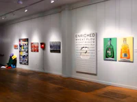 an art gallery with paintings on the walls