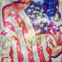 a woman with an american flag on her back