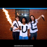 a group of young men holding a firework