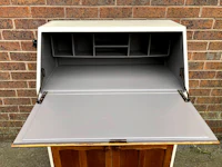 a white and grey desk with an open drawer