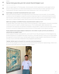 a photo of a man standing in front of a painting