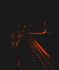 a blurry image of a road at night