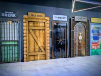 a row of wooden doors in a museum