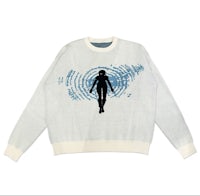 a white sweater with a silhouette of a woman on it