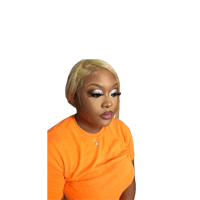 a woman in an orange shirt with a blond wig