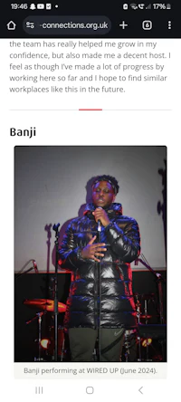 a picture of a man on a phone with a microphone