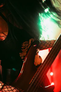 a woman playing a bass guitar