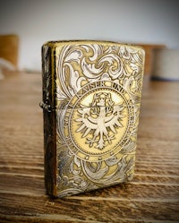 a lighter with an ornate design on it