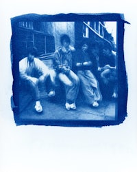 a photo of a group of people sitting on a bench