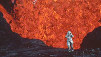 a man standing in front of a lava field