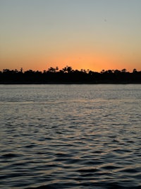 a sunset over a body of water