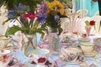 a painting of tea cups and saucers on a table