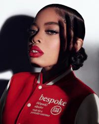 a woman in a red jacket with lipstick on her lips