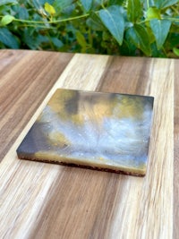 a piece of wood with a white and yellow piece on it