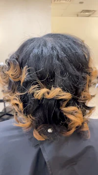 the back of a woman's hair in a salon