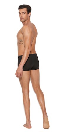 a man in black shorts is posing with his back to the camera