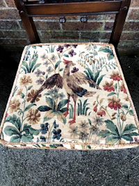 a chair with a bird on it