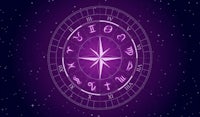 a purple compass with stars in the background