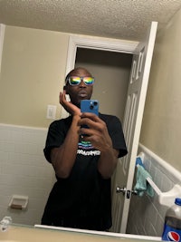 a man taking a selfie in a bathroom