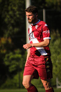 a soccer player is kicking a soccer ball