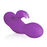 a purple sex toy lying on top of a white surface