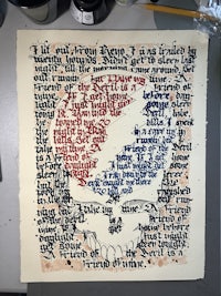 a piece of paper with a red, white and blue flag on it