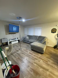 a living room with a tv and a couch