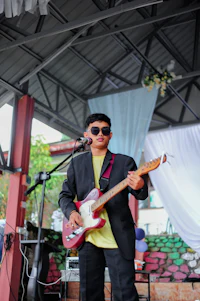 a man playing a guitar