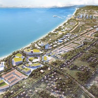 an aerial view of a city near the ocean