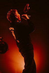 a man is singing into a microphone