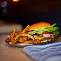 a plate of french fries and a burger
