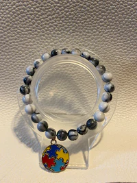 a bracelet with a puzzle piece on it