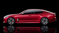 the 2020 kia stinger is shown on a black background