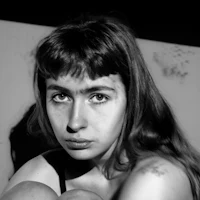 a black and white photo of a woman posing
