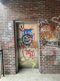 a door with graffiti on it