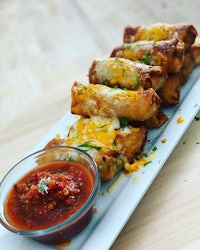 mexican spring rolls with guacamole and dipping sauce