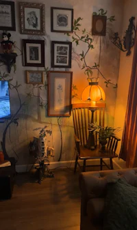 a living room with a tv and pictures on the wall