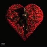 an image of a man laying in a heart made of roses